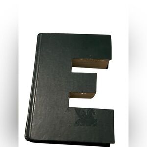 “E” cutout monogram book